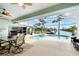 Relaxing pool area with covered lanai and canal view at 10322 Sunbury Dr, Port Charlotte, FL 33981
