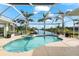 Inviting freeform pool with spa and screened enclosure at 10322 Sunbury Dr, Port Charlotte, FL 33981
