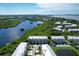 Expansive aerial view showcasing a waterfront community of townhouses at 10360 Longshore Rd # 66, Placida, FL 33946