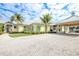 Community clubhouse with inviting patio and landscaping at 10360 Longshore Rd # 66, Placida, FL 33946