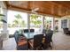Enjoy dining alfresco on this covered patio overlooking the pool at 10360 Longshore Rd # 66, Placida, FL 33946