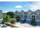 Three-story townhouses with attached garages and lush landscaping near the water at 10360 Longshore Rd # 66, Placida, FL 33946