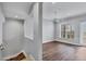 Bright living room with wood flooring, ceiling fan, and access to balcony at 10360 Longshore Rd # 66, Placida, FL 33946