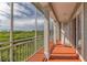 Relaxing screened balcony overlooking lush greenery at 10360 Longshore Rd # 66, Placida, FL 33946