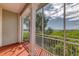 Relaxing screened balcony overlooking lush greenery and water at 10360 Longshore Rd # 66, Placida, FL 33946