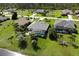 Aerial view of house with pool and canal at 1042 Boundary Blvd, Rotonda West, FL 33947