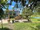 Serene backyard patio with seating and pond views at 1042 Boundary Blvd, Rotonda West, FL 33947