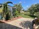 Spacious backyard patio with pond views at 1042 Boundary Blvd, Rotonda West, FL 33947