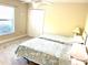 Charming bedroom with two twin beds and window seating at 1042 Boundary Blvd, Rotonda West, FL 33947