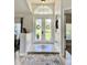 Bright and airy entryway with double doors opening to a backyard view at 1042 Boundary Blvd, Rotonda West, FL 33947
