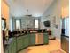 Updated kitchen with teal cabinets and a large island at 1042 Boundary Blvd, Rotonda West, FL 33947