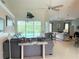 Spacious living room with a view of the pool and lanai at 1042 Boundary Blvd, Rotonda West, FL 33947