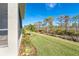 Landscaped backyard with lush greenery and privacy at 10479 Coquina Ct, Placida, FL 33946