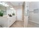 Elegant bathroom with double vanity, large shower, and soaking tub at 10479 Coquina Ct, Placida, FL 33946