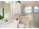 Clean bathroom with single vanity and walk-in shower at 10479 Coquina Ct, Placida, FL 33946