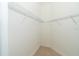 Bright walk-in closet with ample shelving at 10479 Coquina Ct, Placida, FL 33946