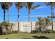 Community entrance sign with stone wall and landscaping at 10479 Coquina Ct, Placida, FL 33946