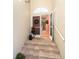 Inviting entryway with double doors and decorative wreaths at 10479 Coquina Ct, Placida, FL 33946