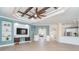 Spacious living area with a built-in entertainment center and high ceilings at 10479 Coquina Ct, Placida, FL 33946