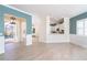Open concept living room with high ceilings and light flooring at 10479 Coquina Ct, Placida, FL 33946