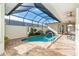 Serene kidney-shaped pool in a covered patio setting at 10479 Coquina Ct, Placida, FL 33946