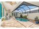 Relaxing kidney-shaped pool with a covered patio at 10479 Coquina Ct, Placida, FL 33946