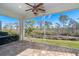 Relaxing screened porch overlooking a lush backyard at 10479 Coquina Ct, Placida, FL 33946