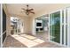 Bright screened porch with tiled floor and access to backyard at 10479 Coquina Ct, Placida, FL 33946