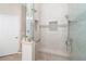 Spa-like shower with glass enclosure and built-in seat at 10479 Coquina Ct, Placida, FL 33946