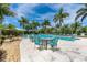 Inviting community pool with plenty of lounge chairs at 10479 Coquina Ct, Placida, FL 33946