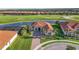 Aerial view of the house by the pond at 10705 Tarflower Dr, Venice, FL 34293