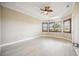 Large bedroom with custom windows, fan and tray ceiling at 10705 Tarflower Dr, Venice, FL 34293