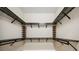Walk-in closet featuring multiple tiers of metal shelving, creating ample storage at 10705 Tarflower Dr, Venice, FL 34293