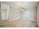 Dining room with wood-look tile and modern lighting at 10705 Tarflower Dr, Venice, FL 34293