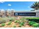 Elegant Sarasota National entrance sign featuring stone accents, decorative water features, and lush landscaping at 10705 Tarflower Dr, Venice, FL 34293