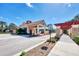 Inviting community entrance showcasing a charming building, well-maintained grounds, and a welcoming pergola at 10705 Tarflower Dr, Venice, FL 34293