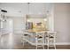 Open kitchen featuring an island with granite counters, modern appliances, and pendant lighting at 10705 Tarflower Dr, Venice, FL 34293