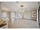 Spacious living room features tile floors, decorative wall features, and elegant lighting at 10705 Tarflower Dr, Venice, FL 34293