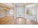 Open concept living area featuring wood floors and a view of the backyard at 10705 Tarflower Dr, Venice, FL 34293