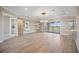 Living room featuring wood floors, a modern chandelier, and access to the lanai at 10705 Tarflower Dr, Venice, FL 34293