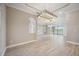 Open living space featuring contemporary lighting and neutral color palette at 10705 Tarflower Dr, Venice, FL 34293