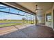 View of the screened-in patio with lovely views at 10705 Tarflower Dr, Venice, FL 34293