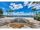 Community water fountain with palm trees and lake view at 10705 Tarflower Dr, Venice, FL 34293