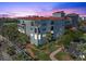 Building at dusk, showcasing architectural details and landscaping at 11200 Hacienda Del Mar Blvd # 201, Placida, FL 33946