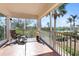 Relaxing screened balcony overlooking lush landscaping and pool at 11200 Hacienda Del Mar Blvd # 201, Placida, FL 33946