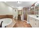 Bathroom with double vanity, shower, and a soaking tub at 11200 Hacienda Del Mar Blvd # 201, Placida, FL 33946