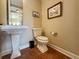 Elegant powder room with pedestal sink and tiled floor at 11200 Hacienda Del Mar Blvd # 201, Placida, FL 33946