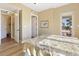 Bright bedroom with ensuite bathroom and access to balcony at 11200 Hacienda Del Mar Blvd # 201, Placida, FL 33946