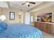 King-size bed, hardwood floors, large TV, and ensuite bathroom at 11200 Hacienda Del Mar Blvd # 201, Placida, FL 33946