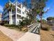 Boardwalk path leading to waterfront with lush landscaping and building views at 11200 Hacienda Del Mar Blvd # 201, Placida, FL 33946